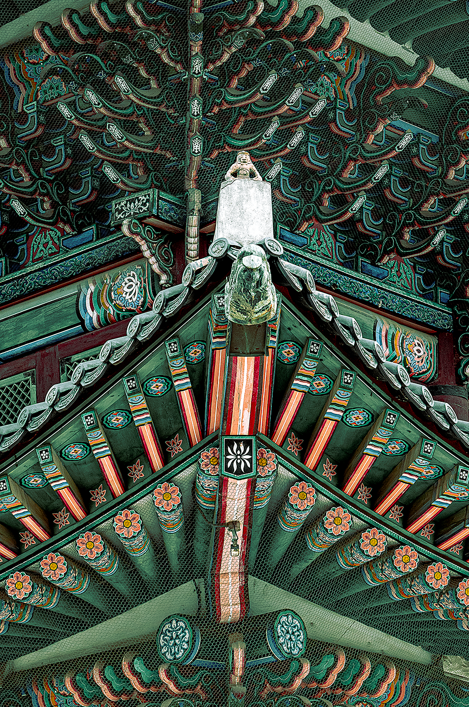 Fine Art Photography of monkey statue in traditional Korean temple architecture, Exhibit Limited Edition with vibrant roof details and depth.