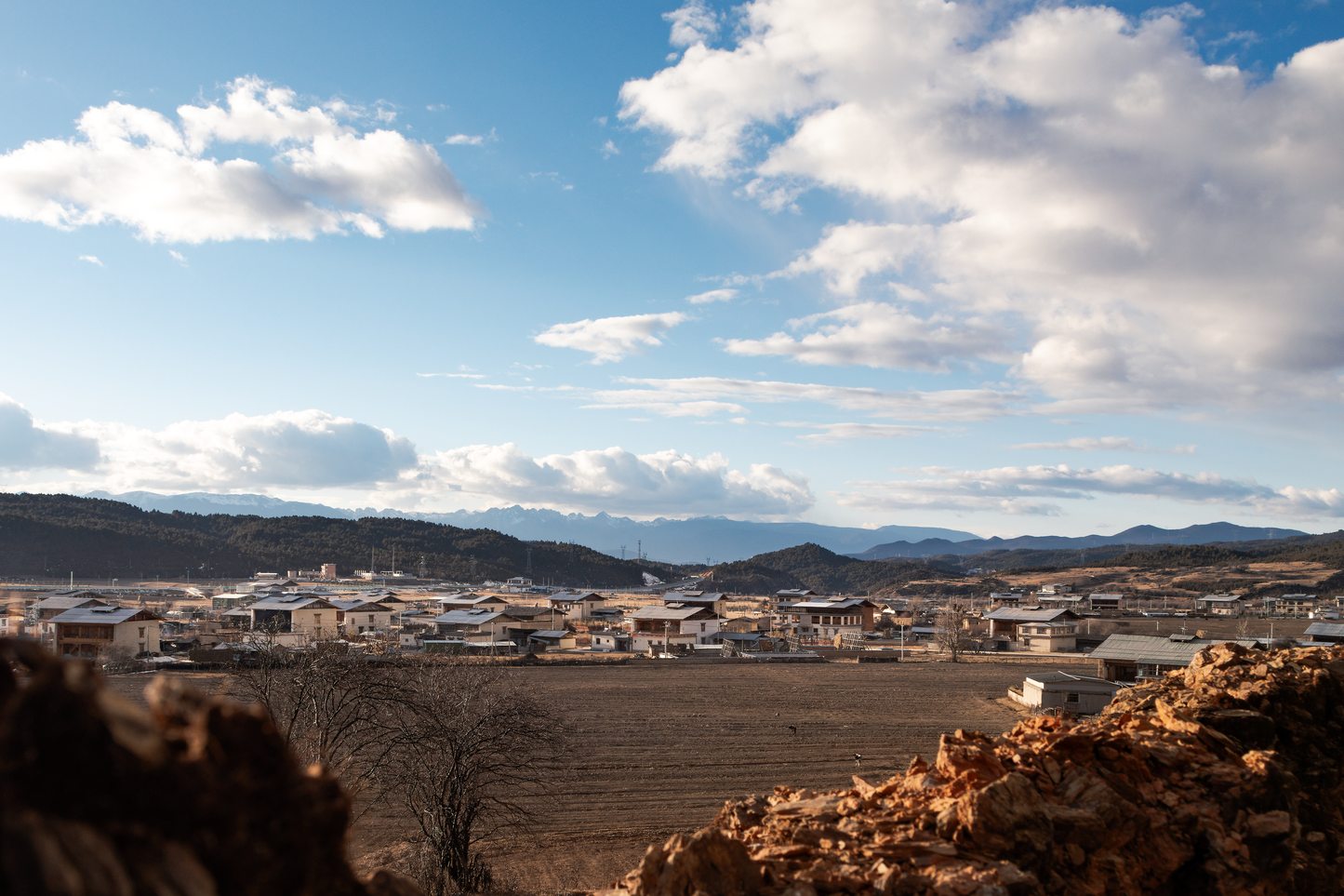 Fine Art Photography of hillside village, ruins, and distant mountains, Variance Limited Edition exploring contrast between old structures and sky.